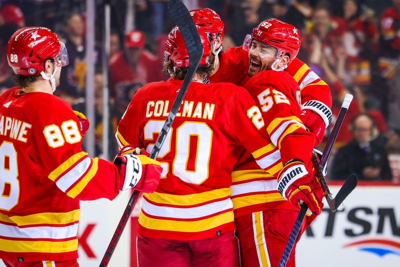 Apr 18, 2024; Calgary, Alberta, CAN; Calgary Flames defenseman MacKenzie Weegar (52) celebrates his goal with teammates against the San Jose Sharks during the second period at Scotiabank Saddledome. Mandatory Credit: Sergei Belski-USA TODAY Sports