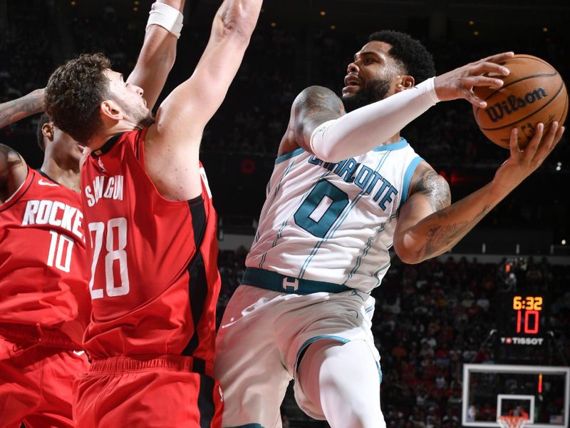 HOUSTON, TX - OCTOBER 23:  Miles Bridges #0 of the Charlotte Hornets drives to the basket during the game against the Houston Rockets  during a regular season game on October 23, 2024 at the Toyota Center in Houston, Texas. NOTE TO USER: User expressly acknowledges and agrees that, by downloading and or using this photograph, User is consenting to the terms and conditions of the Getty Images License Agreement. Mandatory Copyright Notice: Copyright 2024 NBAE (Photo by Logan Riely/NBAE via Getty Images)