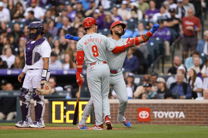 May 24, 2024; Denver, Colorado, USA; Philadelphia Phillies shortstop Edmundo Sosa (33) celebrates his solo home run with center fielder Whit Merrifield (9) in the fifth inning against the Colorado Rockies at Coors Field. Mandatory Credit: Isaiah J. Downing-USA TODAY Sports