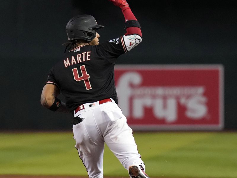 Aug 26, 2023; Phoenix, Arizona, USA; Arizona Diamondbacks second baseman Ketel Marte (4) runs the bases after hitting a three run home run against the Cincinnati Reds during the fifth inning at Chase Field. Mandatory Credit: Joe Camporeale-USA TODAY Sports