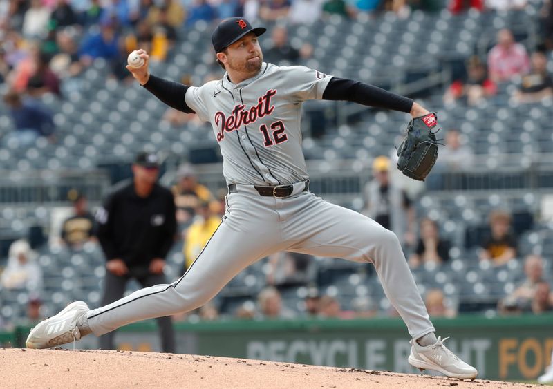 Apr 9, 2024; Pittsburgh, Pennsylvania, USA;  Detroit Tigers starting pitcher Casey Mize (12) delivers against the Pittsburgh Pirates during the first inning at PNC Park. Mandatory Credit: Charles LeClaire-USA TODAY Sports