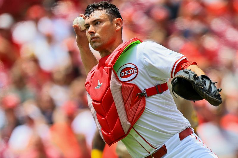 May 23, 2024; Cincinnati, Ohio, USA; Cincinnati Reds catcher Luke Maile (22) throws to third to get San Diego Padres third baseman Manny Machado (not pictured) out in the first inning at Great American Ball Park. Mandatory Credit: Katie Stratman-USA TODAY Sports