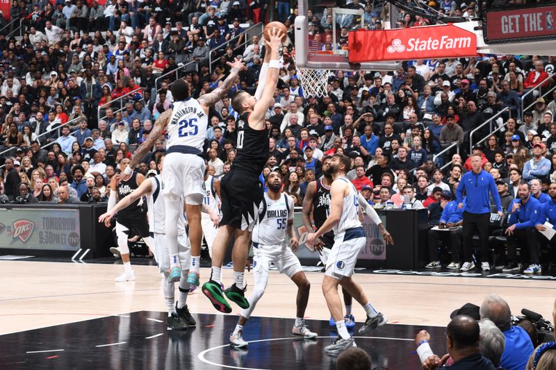 LOS ANGELES, CA - APRIL 23: Ivica Zubac #40 of the LA Clippers dunks the ball during the game against the Dallas Mavericks during Round 1 Game 2 of the 2024 NBA Playoffs on April 23, 2024 at Crypto.Com Arena in Los Angeles, California. NOTE TO USER: User expressly acknowledges and agrees that, by downloading and/or using this Photograph, user is consenting to the terms and conditions of the Getty Images License Agreement. Mandatory Copyright Notice: Copyright 2024 NBAE (Photo by Andrew D. Bernstein/NBAE via Getty Images)