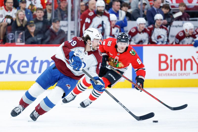 Nov 23, 2025; Chicago, Illinois, USA; Colorado Avalanche defenseman Samuel Girard (49) looks to pass the puck against the Chicago Blackhawks during the first period at United Center. Mandatory Credit: Kamil Krzaczynski-Imagn Images