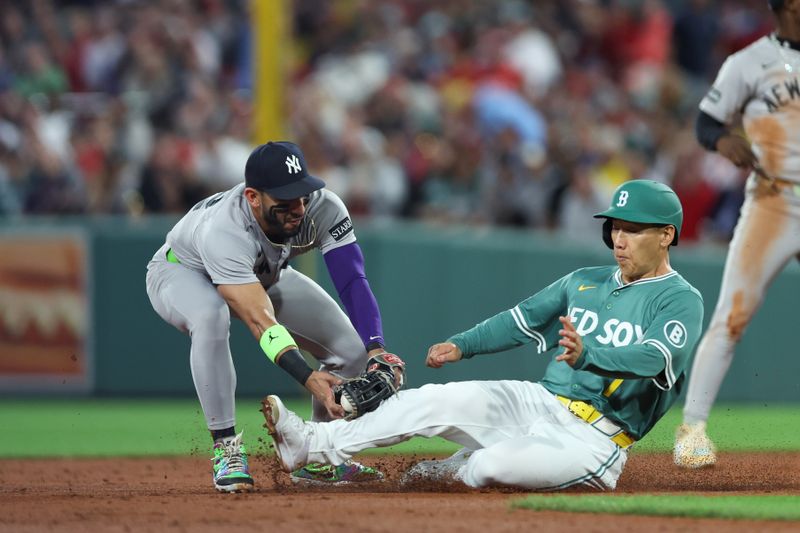 Sep 12, 2025; Boston, Massachusetts, USA; New York Yankees shortstop Jose Caballero (72) tags out Boston Red Sox designated hitter Masataka Yoshida (7) during the second inning at Fenway Park. Mandatory Credit: Paul Rutherford-Imagn Images
