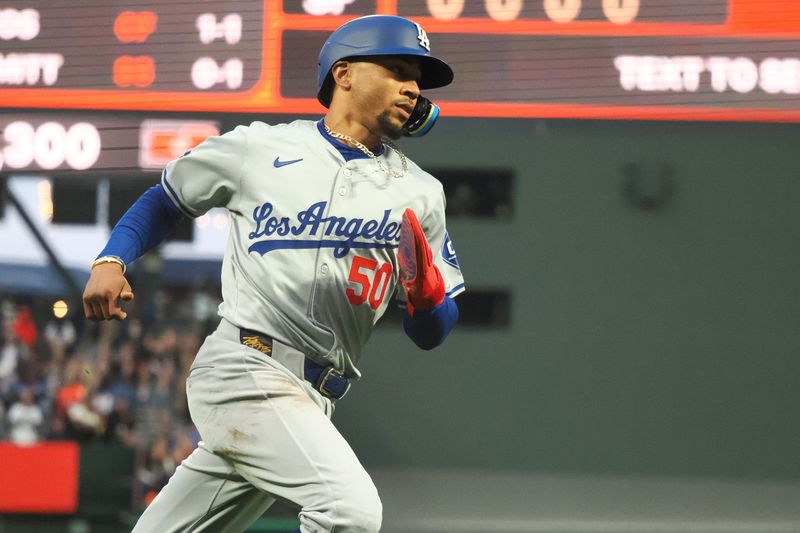 May 14, 2024; San Francisco, California, USA; Los Angeles Dodgers shortstop Mookie Betts (50) scores a run against the San Francisco Giants during the fifth inning at Oracle Park. Mandatory Credit: Kelley L Cox-USA TODAY Sports