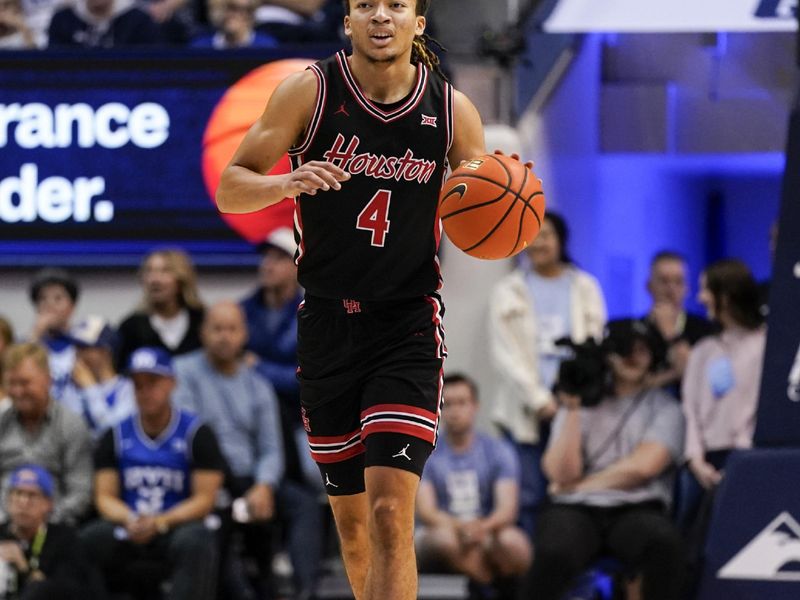 Feb 7, 2026; Provo, Utah, USA; Houston Cougars guard Kingston Flemings (4) dribbles the ball during the second half against the BYU Cougars at Marriott Center. Mandatory Credit: Aaron Baker-Imagn Images