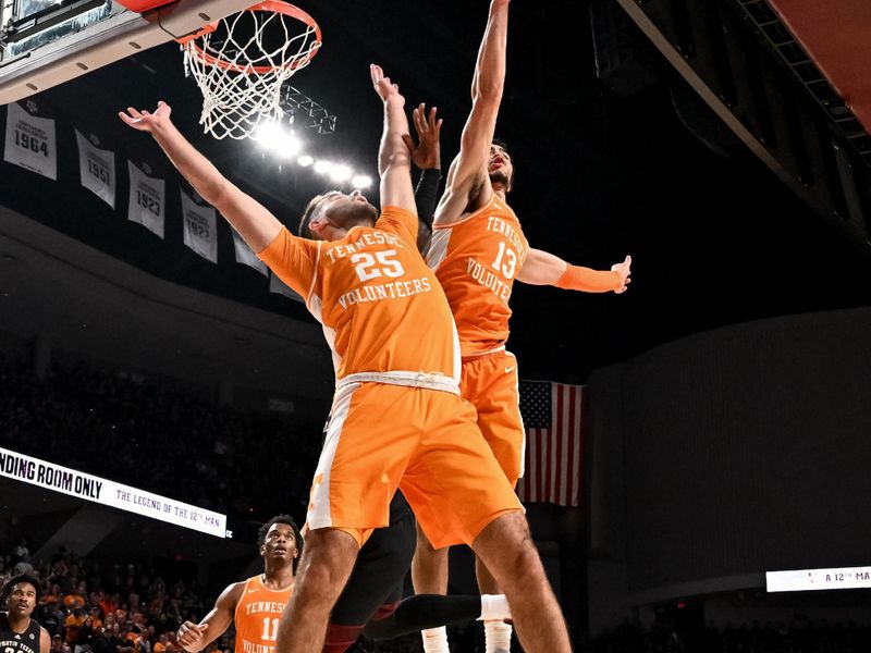 Feb 21, 2023; College Station, Texas, USA; Tennessee Volunteers forward Olivier Nkamhoua (13) blocks a shot against the Texas A&M Aggies during the second half at Reed Arena. Mandatory Credit: Maria Lysaker-USA TODAY Sports