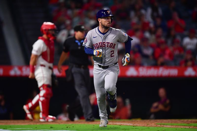 Sep 13, 2024; Anaheim, California, USA; Houston Astros third baseman Alex Bregman (2) hits a single against the Los Angeles Angels during the seventh inning at Angel Stadium. Mandatory Credit: Gary A. Vasquez-Imagn Images