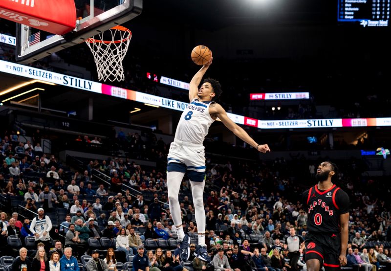 MINNEAPOLIS, MINNESOTA - APRIL 3: Josh Minott #8 of the Minnesota Timberwolves dunks the ball in the fourth quarter of the game against the Toronto Raptors at Target Center on April 3, 2024 in Minneapolis, Minnesota. NOTE TO USER: User expressly acknowledges and agrees that, by downloading and or using this photograph, User is consenting to the terms and conditions of the Getty Images License Agreement. (Photo by Stephen Maturen/Getty Images)