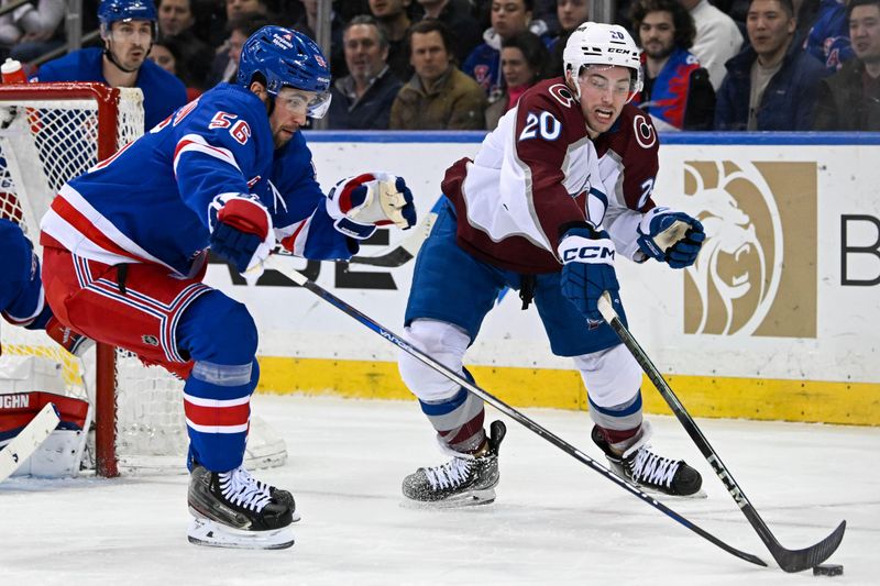 Feb 5, 2024; New York, New York, USA;  New York Rangers defenseman Erik Gustafsson (56) and Colorado Avalanche center Ross Colton (20) battle over the puck during the second period at Madison Square Garden. Mandatory Credit: Dennis Schneidler-USA TODAY Sports