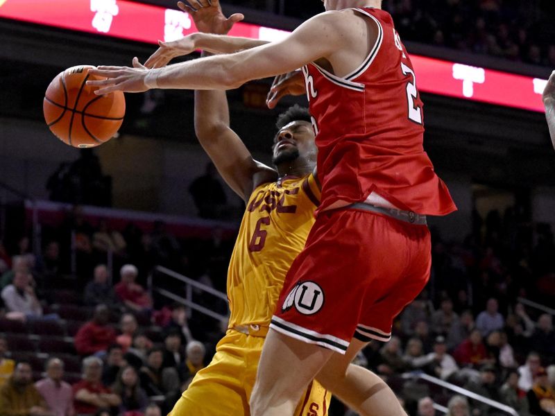 Feb 15, 2024; Los Angeles, California, USA; Southern California Trojans guard Bronny James (6) gets fouled by Utah Utes guard Cole Bajema (2) during the second half of an NCAA basketball game at Galen Center. Mandatory Credit: Alex Gallardo-USA TODAY Sports