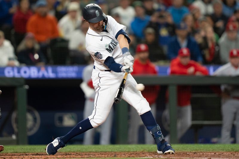 Apr 21, 2023; Seattle, Washington, USA; Seattle Mariners designated hitter AJ Pollock (8) hits a two-run RBI double during the sixth inning against the St. Louis Cardinals at T-Mobile Park. Mandatory Credit: Stephen Brashear-USA TODAY Sports