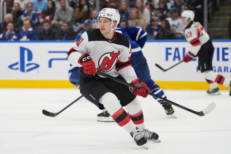 Oct 21, 2025; Toronto, Ontario, CAN; New Jersey Devils forward Arseny Gritsyuk (81) skates against the Toronto Maple Leafs during the second period at Scotiabank Arena. Mandatory Credit: John E. Sokolowski-Imagn Images