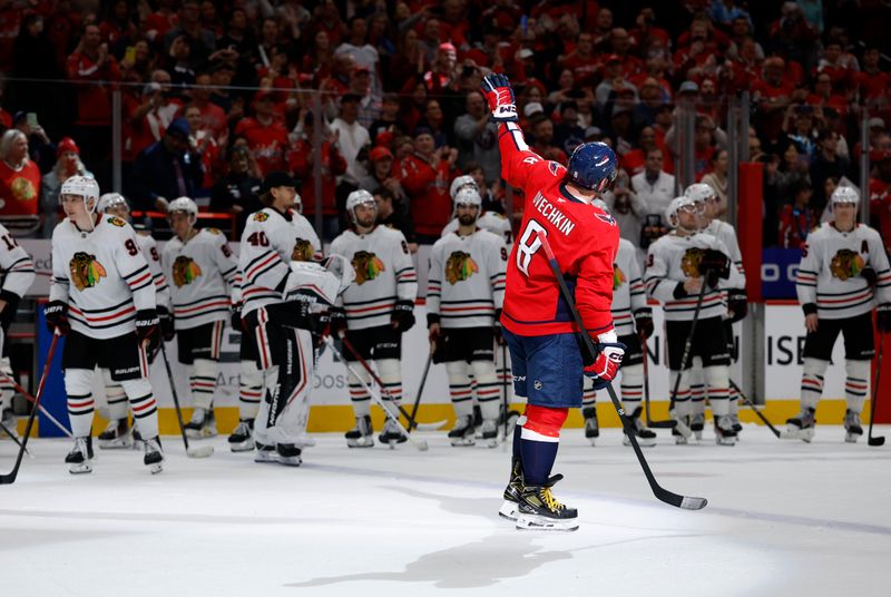 Apr 4, 2025; Washington, District of Columbia, USA; Washington Capitals left wing Alex Ovechkin (8) waves to the crowd after the game against the Chicago Blackhawks at Capital One Arena. Ovechkin scored the 893rd and 894th goals of his career, tying Wayne Gretzky for most all-time goals scored in the NHL. Mandatory Credit: Geoff Burke-Imagn Images