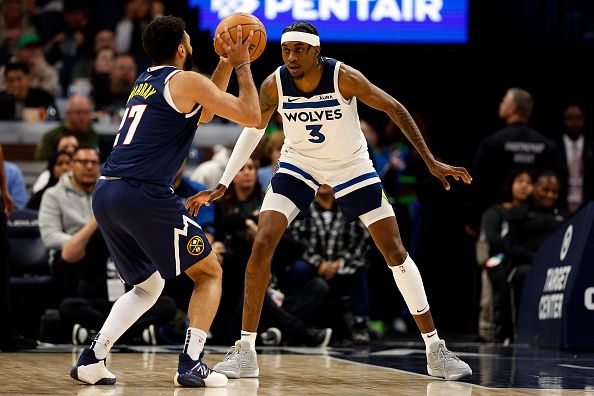 MINNEAPOLIS, MINNESOTA - NOVEMBER 01: Jamal Murray #27 of the Denver Nuggets competes while Jaden McDaniels #3 of the Minnesota Timberwolves defends in the first quarter at Target Center on November 01, 2023 in Minneapolis, Minnesota. The Timberwolves defeated the Nuggets 110-89. NOTE TO USER: User expressly acknowledges and agrees that, by downloading and or using this photograph, User is consenting to the terms and conditions of the Getty Images License Agreement. (Photo by David Berding/Getty Images)