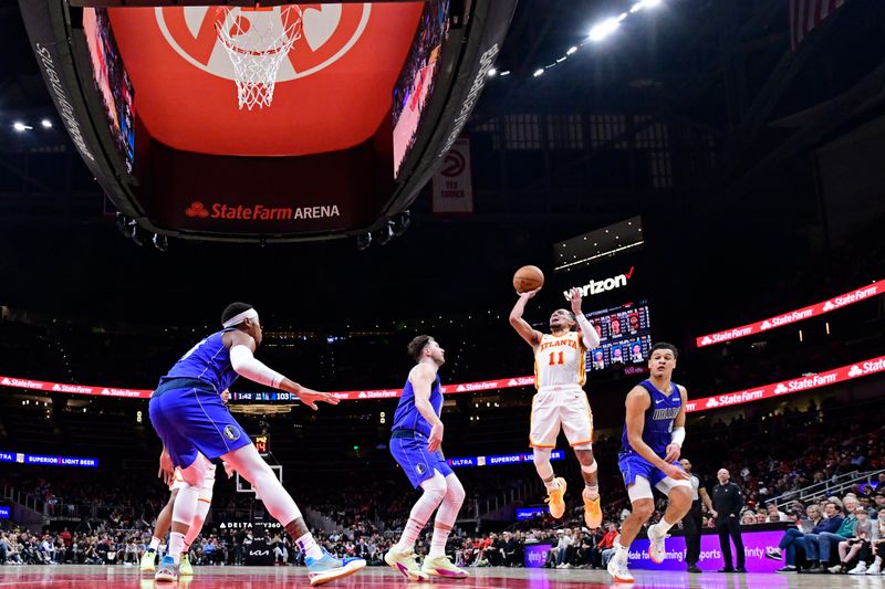 ATLANTA, GA - JANUARY 26: Trae Young #11 of the Atlanta Hawks shoots the ball during the game against the Dallas Mavericks on January 26, 2024 at State Farm Arena in Atlanta, Georgia.  NOTE TO USER: User expressly acknowledges and agrees that, by downloading and/or using this Photograph, user is consenting to the terms and conditions of the Getty Images License Agreement. Mandatory Copyright Notice: Copyright 2024 NBAE (Photo by Adam Hagy/NBAE via Getty Images)