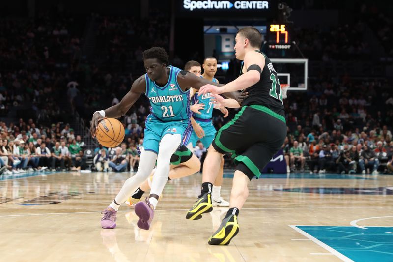 CHARLOTTE, NC - APRIL 1: JT Thor #21 of the Charlotte Hornets handles the ball during the game against the Boston Celtics on April 1, 2024 at Spectrum Center in Charlotte, North Carolina. NOTE TO USER: User expressly acknowledges and agrees that, by downloading and or using this photograph, User is consenting to the terms and conditions of the Getty Images License Agreement.  Mandatory Copyright Notice:  Copyright 2024 NBAE (Photo by Brock Williams-Smith/NBAE via Getty Images)