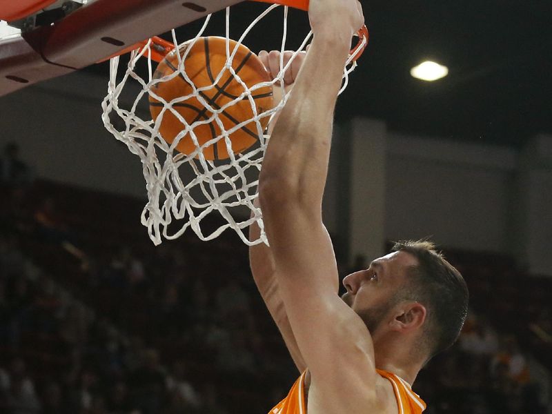 Jan 17, 2023; Starkville, Mississippi, USA; Tennessee Volunteers forward Uros Plavsic (33) dunks during the first half against the Mississippi State Bulldogs at Humphrey Coliseum. Mandatory Credit: Petre Thomas-USA TODAY Sports