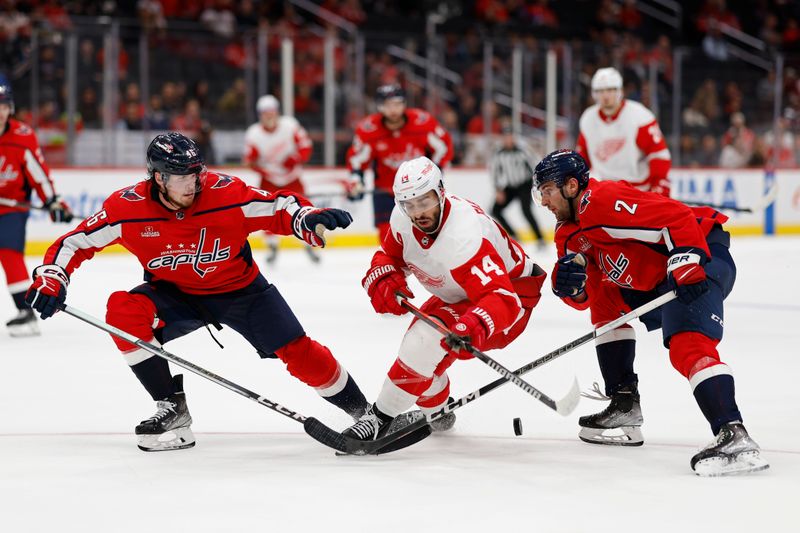 Sep 28, 2023; Washington, District of Columbia, USA; Detroit Red Wings center Robby Fabbri (14) skates with the puck as Washington Capitals defenseman Lucas Johansen (46) and Capitals defenseman Vincent Iorio (2) defend in the third period at Capital One Arena. Mandatory Credit: Geoff Burke-USA TODAY Sports