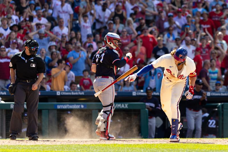 Aug 13, 2023; Philadelphia, Pennsylvania, USA; Philadelphia Phillies first baseman Alec Bohm (28) slams his bat to the ground in front of Minnesota Twins catcher Ryan Jeffers (27) after being called out on a strike by umpire Alex Mackay to end the seventh inning at Citizens Bank Park. Mandatory Credit: Bill Streicher-USA TODAY Sports