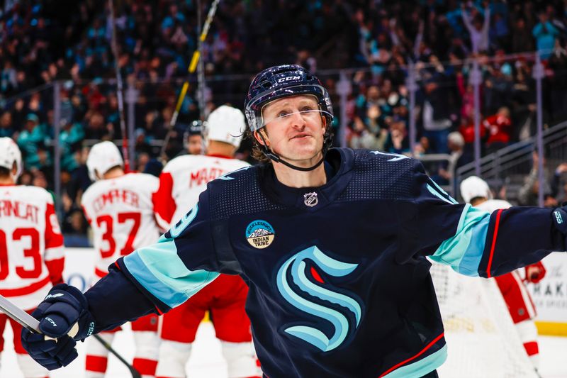 Feb 19, 2024; Seattle, Washington, USA; Seattle Kraken left wing Jared McCann (19) celebrates after scoring a goal against the Detroit Red Wings during the second period at Climate Pledge Arena. Mandatory Credit: Joe Nicholson-USA TODAY Sports