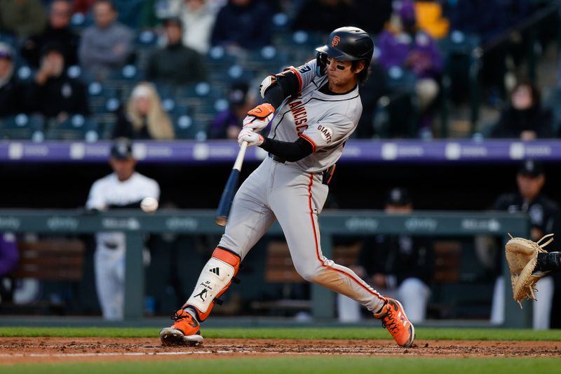 May 7, 2024; Denver, Colorado, USA; San Francisco Giants center fielder Jung Hoo Lee (51) hits a single in the fourth inning against the Colorado Rockies at Coors Field. Mandatory Credit: Isaiah J. Downing-USA TODAY Sports