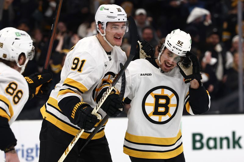 Jan 10, 2026; Boston, Massachusetts, USA; Boston Bruins center Marat Khusnutdinov (92) is congratulated by defenseman Nikita Zadorov (91) after scoring against the New York Rangers during the third period at TD Garden. Mandatory Credit: Winslow Townson-Imagn Images