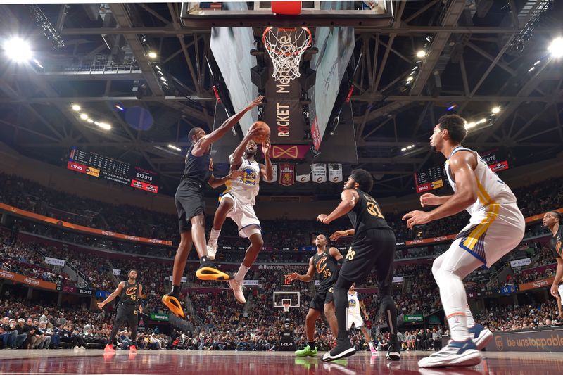 CLEVELAND, OH - NOVEMBER 8: Andrew Wiggins #22 of the Golden State Warriorsc shoots the ball during the game against the Cleveland Cavaliers  during a regular season game on November 8, 2024 at Rocket Mortgage FieldHouse in Cleveland, Ohio. NOTE TO USER: User expressly acknowledges and agrees that, by downloading and/or using this Photograph, user is consenting to the terms and conditions of the Getty Images License Agreement. Mandatory Copyright Notice: Copyright 2024 NBAE (Photo by David Liam Kyle/NBAE via Getty Images)
