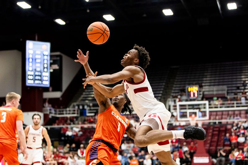 Feb 4, 2026; Stanford, California, USA;  Clemson Tigers guard Jestin Porter (1) blocks Stanford Cardinal guard Ebuka Okorie (1) during the first half at Maples Pavilion. Mandatory Credit: John Hefti-Imagn Images