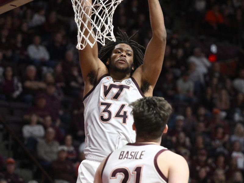 Feb 18, 2023; Blacksburg, Virginia, USA;  Virginia Tech Hokies forward Mylyjael Poteat (34) dunks against the Pittsburgh Panthers in the second half at Cassell Coliseum. Mandatory Credit: Lee Luther Jr.-USA TODAY Sports