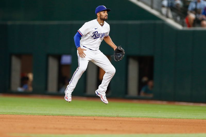 Aug 2, 2023; Arlington, Texas, USA; Texas Rangers second baseman Marcus Semien (2) jumps as the pitch is delivered during the fifth inning against the Chicago White Sox at Globe Life Field. Mandatory Credit: Andrew Dieb-USA TODAY Sports