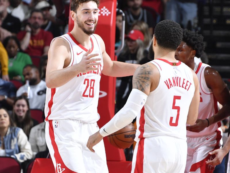 HOUSTON, TX - NOVEMBER 6:  Alperen Sengun #28 and Fred VanVleet #5 of the Houston Rockets high five during the game against the San Antonio Spurs on November 6, 2024 at the Toyota Center in Houston, Texas. NOTE TO USER: User expressly acknowledges and agrees that, by downloading and or using this photograph, User is consenting to the terms and conditions of the Getty Images License Agreement. Mandatory Copyright Notice: Copyright 2024 NBAE (Photo by Logan Riely/NBAE via Getty Images)