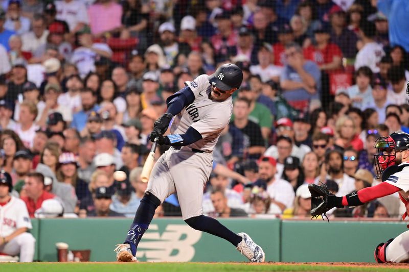 Jul 28, 2024; Boston, Massachusetts, USA; New York Yankees catcher Austin Wells (28) hits a double against the Boston Red Sox during the fourth inning at Fenway Park. Mandatory Credit: Eric Canha-USA TODAY Sports