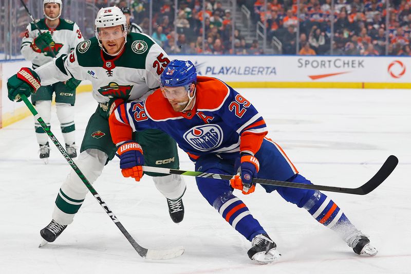 Dec 8, 2023; Edmonton, Alberta, CAN; Minnesota Wild defensemen Jonas Brodin (25) and Edmonton Oilers forward Leon Draisaitl (29) battles for position during the first period at Rogers Place. Mandatory Credit: Perry Nelson-USA TODAY Sports