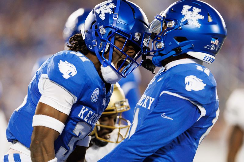 Sep 16, 2023; Lexington, Kentucky, USA; Kentucky Wildcats defensive back Maxwell Hairston (31) celebrates with defensive back Zion Childress (11) during the first quarter against the Akron Zips celebrates with  at Kroger Field. Mandatory Credit: Jordan Prather-USA TODAY Sports