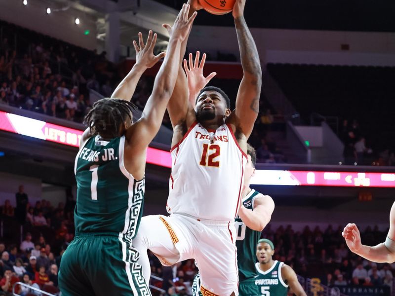 Feb 1, 2025; Los Angeles, California, USA;  USC Trojans forward Rashaun Agee (12) shoots a jump shot against the Michigan State Spartans during the first half at Galen Center. Mandatory Credit: William Navarro-Imagn Images