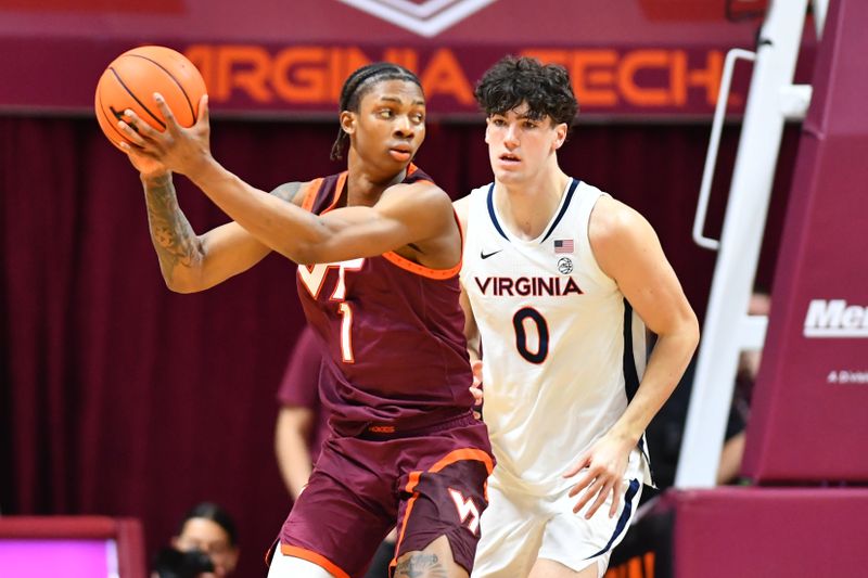 Feb 15, 2025; Blacksburg, Virginia, USA;  Virginia Tech Hokies forward Tobi Lawal (1) works against Virginia Cavaliers forward Blake Buchanan (0) during the second half at Cassell Coliseum. Mandatory Credit: Brian Bishop-Imagn Images