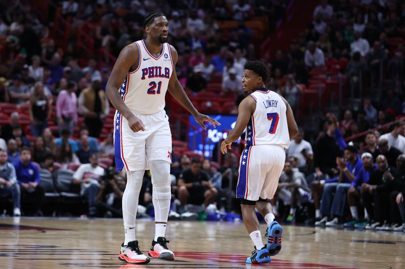 MIAMI, FLORIDA - APRIL 04: Joel Embiid #21 and Kyle Lowry #7 of the Philadelphia 76ers react during the third quarter of the game against the Miami Heat at Kaseya Center on April 04, 2024 in Miami, Florida. NOTE TO USER: User expressly acknowledges and agrees that, by downloading and or using this photograph, User is consenting to the terms and conditions of the Getty Images License Agreement. (Photo by Megan Briggs/Getty Images)