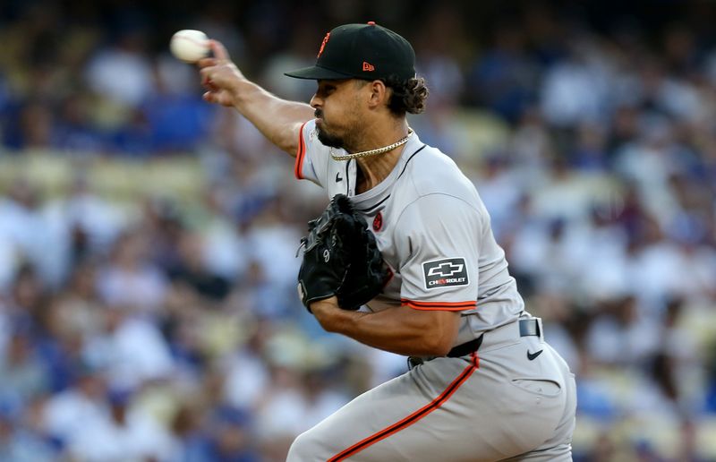 Jul 23, 2024; Los Angeles, California, USA; San Francisco Giants pitcher Jordan Hicks (12) throws during the first inning against the Los Angeles Dodgers at Dodger Stadium. Mandatory Credit: Jason Parkhurst-USA TODAY Sports