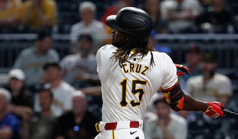 May 21, 2024; Pittsburgh, Pennsylvania, USA;  Pittsburgh Pirates shortstop Oneil Cruz (15) hits an RBI double against the San Francisco Giants during the ninth inning at PNC Park. Mandatory Credit: Charles LeClaire-USA TODAY Sports