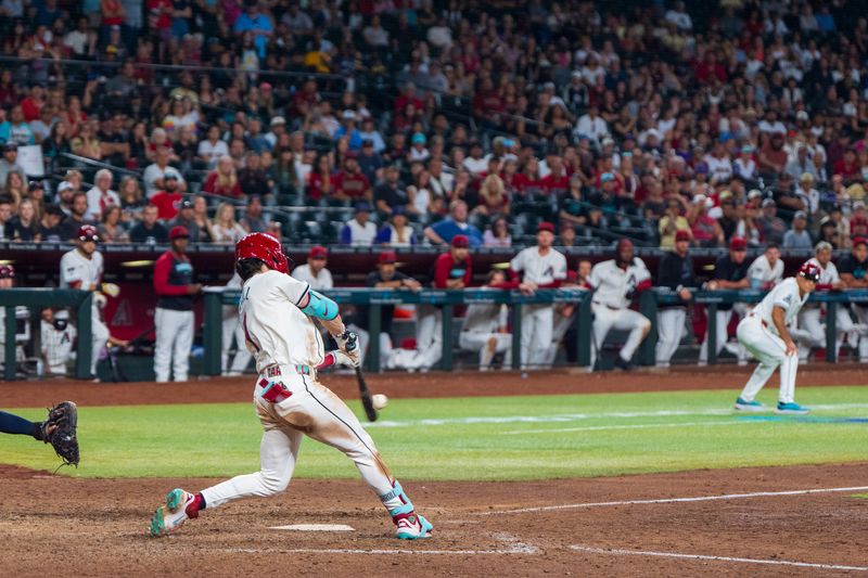 Sep 15, 2024; Phoenix, Arizona, USA; Arizona Diamondbacks outfielder Corbin Carroll (7) hits a sharp single in the 10th inning inning during a game against the Milwaukee Brewers at Chase Field. Mandatory Credit: Allan Henry-Imagn Images