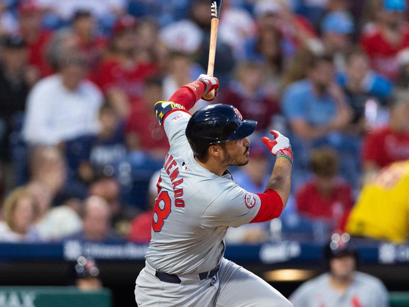 May 31, 2024; Philadelphia, Pennsylvania, USA; St. Louis Cardinals third base Nolan Arenado (28) hits a home run during the seventh inning against the Philadelphia Phillies at Citizens Bank Park. Mandatory Credit: Bill Streicher-USA TODAY Sports