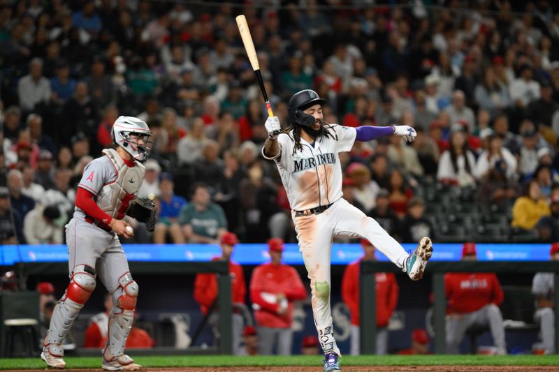 Sep 11, 2023; Seattle, Washington, USA; Seattle Mariners shortstop J.P. Crawford (3) strikes out to the Los Angeles Angels during the tenth inning at T-Mobile Park. Mandatory Credit: Steven Bisig-USA TODAY Sports