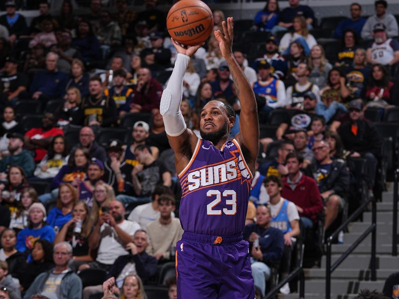 DENVER, CO - OCTOBER 13: Monte Morris #23 of the Phoenix Suns shoots a three point basket during the game against the Denver Nuggets on October 13, 2024 at Ball Arena in Denver, Colorado. NOTE TO USER: User expressly acknowledges and agrees that, by downloading and/or using this Photograph, user is consenting to the terms and conditions of the Getty Images License Agreement. Mandatory Copyright Notice: Copyright 2024 NBAE (Photo by Bart Young/NBAE via Getty Images)