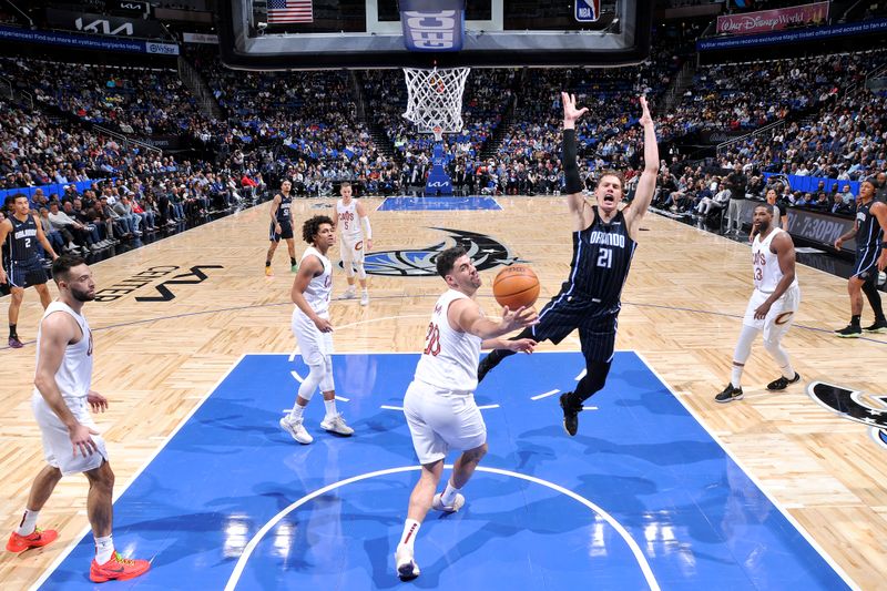 ORLANDO, FL - JANUARY 22: Georges Niang #20 of the Cleveland Cavaliers grabs a rebound during the game against the Orlando Magic on January 22, 2024 at Kia Center in Orlando, Florida. NOTE TO USER: User expressly acknowledges and agrees that, by downloading and or using this photograph, User is consenting to the terms and conditions of the Getty Images License Agreement. Mandatory Copyright Notice: Copyright 2024 NBAE (Photo by Fernando Medina/NBAE via Getty Images)