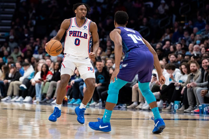 CHARLOTTE, NORTH CAROLINA - JANUARY 20: Ish Smith #14 of the Charlotte Hornets guards Tyrese Maxey #0 of the Philadelphia 76ers in the third quarter during their game at Spectrum Center on January 20, 2024 in Charlotte, North Carolina. NOTE TO USER: User expressly acknowledges and agrees that, by downloading and or using this photograph, User is consenting to the terms and conditions of the Getty Images License Agreement. (Photo by Jacob Kupferman/Getty Images)