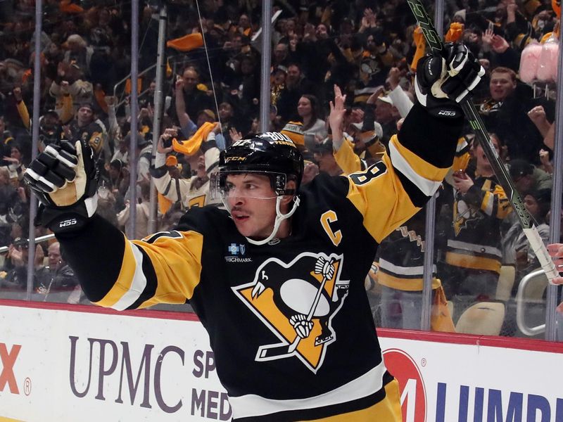 Nov 2, 2024; Pittsburgh, Pennsylvania, USA;  Pittsburgh Penguins center Sidney Crosby (87) reacts after scoring a goal against the Montreal Canadiens during the first period at PPG Paints Arena. Mandatory Credit: Charles LeClaire-Imagn Images