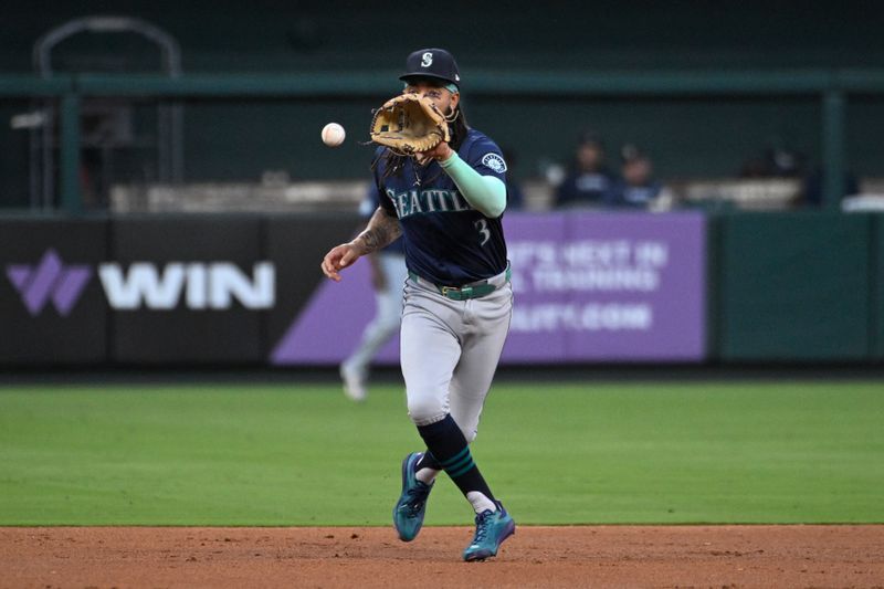 Sep 7, 2024; St. Louis, Missouri, USA; Seattle Mariners shortstop J.P. Crawford (3) fields a ground ball by the St. Louis Cardinals in the third inning at Busch Stadium. Mandatory Credit: Joe Puetz-Imagn Images