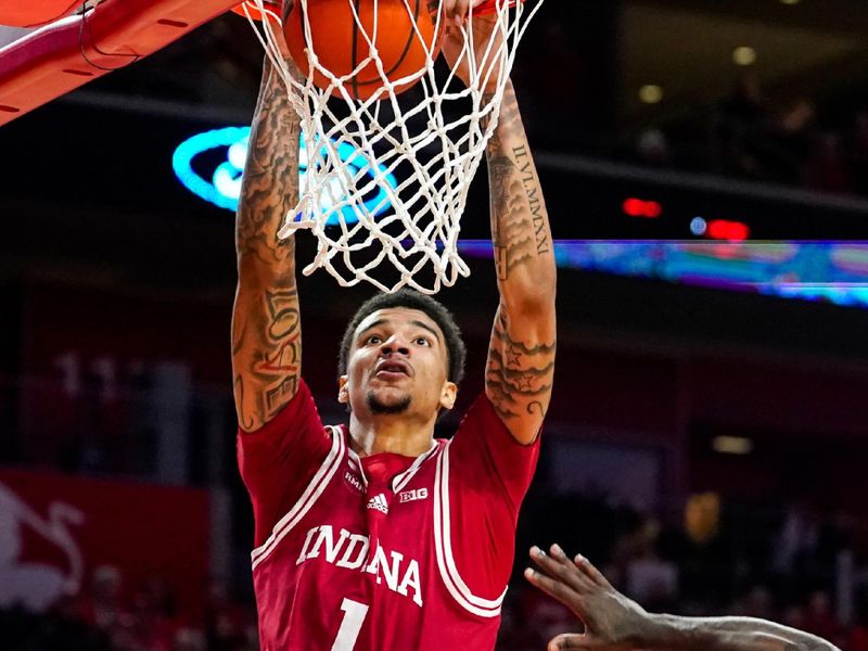 Jan 3, 2024; Lincoln, Nebraska, USA; Indiana Hoosiers center Kel'el Ware (1) dunks the ball against Nebraska Cornhuskers forward Juwan Gary (4) during the second half at Pinnacle Bank Arena. Mandatory Credit: Dylan Widger-USA TODAY Sports